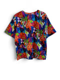 A short-sleeve crewneck t-shirt featuring a vibrant, multicolored abstract pattern with geometric shapes and stylized floral elements in red, blue, green, purple, orange, and yellow, displayed flat against a white background.